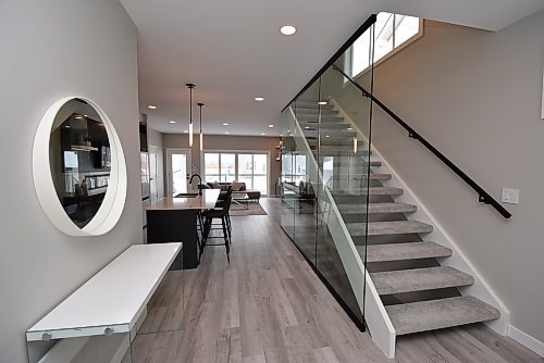 Todd Lewys / Winnipeg Free Press

The open-riser upper level staircase is defined by tempered glass feature wall that adds style and promotes light flow.


8. Upper Level Window - 52 Goodman Drive
