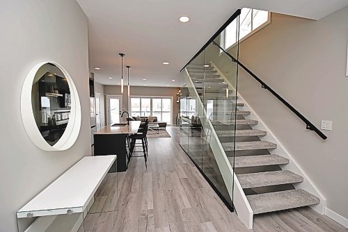 Todd Lewys / Winnipeg Free Press

The open-riser upper level staircase is defined by tempered glass feature wall that adds style and promotes light flow.


8. Upper Level Window - 52 Goodman Drive
