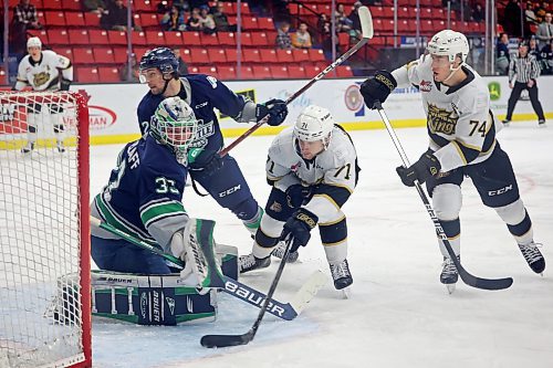 Zakhar Polshakov (71) and Brett Hyland (74) of the Brandon Wheat Kings chase the puck into Seattle goaltender Scott Ratzlaff’s crease during WHL action at Westoba Place on Tuesday evening. 
(Photos by Tim Smith/The Brandon Sun)