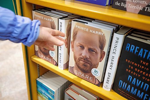 MIKE DEAL / WINNIPEG FREE PRESS
Tannis Thompsett purchases Prince Harry's memoire, Spare, at McNally Robinson GrantPark Tuesday afternoon. 
See Ben Sigurdson story
230110 - Tuesday, January 10, 2023.