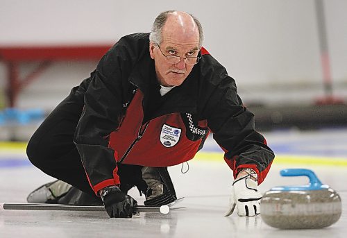 Brandon Sun 16032009 Skip Ray Orr of Minnedosa throws a rock during the Provincial Masters Men's Curling Final against Bob Turner's rink from Thistle at the Minnedosa Curling Club on Monday afternoon. (Tim Smith/Brandon Sun)