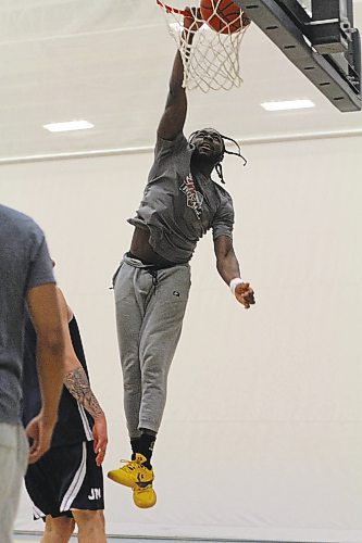 Eli Ampofo dunks during Brandon University Bobcats men's basketball practice on Thursday. (Thomas Friesen/The Brandon Sun)