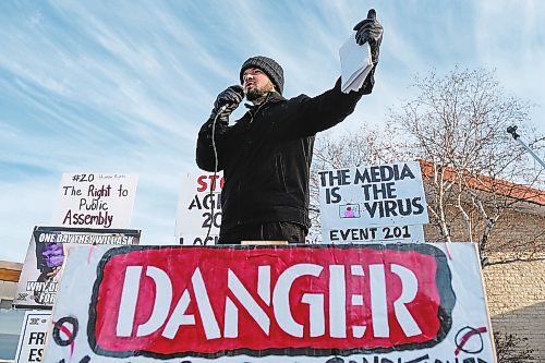 Daniel Crump / Winnipeg Free Press. Pastor Tobias Tissen speaks to protestors gathered at city hall in Steinbach, Manitoba. January 16, 2021.