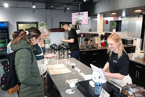 The staff of Bailey's, Brandon University's newest café, take students orders following Friday's grand opening ceremony in the school’s Knowles-Douglas building. (Kyle Darbyson/The Brandon Sun)