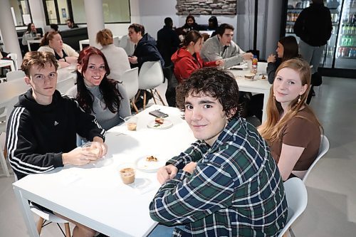 Brandon University students check out the food and drinks that Bailey's has to offer during the café's official grand opening Friday morning. (Kyle Darbyson/The Brandon Sun)