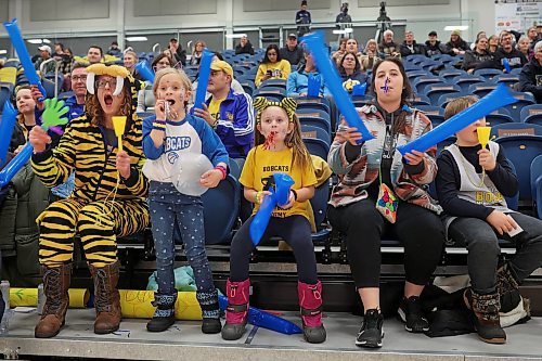 13012023
Kate Slagle, Ella Bambury, Baylor Taggart, Cailee Plante and Wes Bambury cheer for the Brandon University Bobcats women's basketball team during university basketball action against&#xa0;the University of Manitoba Bison at the BU Healthy Living Centre on Friday evening. (Tim Smith/The Brandon Sun)