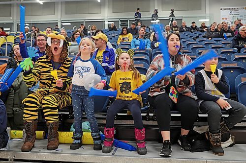 13012023
Kate Slagle, Ella Bambury, Baylor Taggart, Cailee Plante and Wes Bambury cheer for the Brandon University Bobcats women's basketball team during university basketball action against&#xa0;the University of Manitoba Bison at the BU Healthy Living Centre on Friday evening. (Tim Smith/The Brandon Sun)