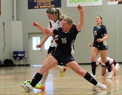 ACC's Tonielle Bachewich dribbles while Providence Pilots Amieka de Klein defends during MCAC women's futsal game at the Healthy Living Centre on Saturday morning. Providence won 5-0. (Thomas Friesen/The Brandon Sun)