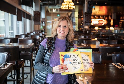 JESSICA LEE / WINNIPEG FREE PRESS

Former Winnipeg TV sports reporter Lisa Bowes is photographed with her book on January 14, 2023 at Brown&#x2019;s Social House.

Reporter: Joshua Frey-Sam