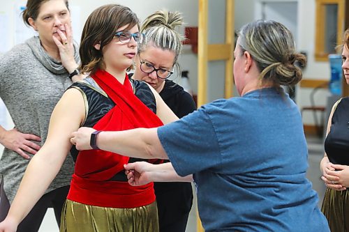 DI Productions volunteers tweak some costumes during Saturday's group rehearsal of "Aladdin Jr." at the Brandon School of Dance. (Kyle Darbyson/The Brandon Sun)