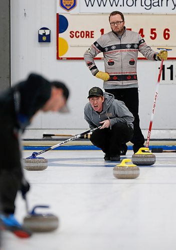 JOHN WOODS / WINNIPEG FREE PRESS
Justin Reynolds, skip of The Beach Boys, calls out to his sweeper as Andrew Irving looks on in the Asham final of the MB Open Bonspiel Monday, January 16, 2023. 

Re: ?