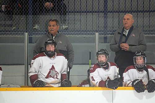 Assiniboine Community College Cougars women’s hockey coaches Tony Bertone, left, and Terry Senkbeil keep an eye on the action during a game at the Sportsplex earlier this season. (Lucas Punkari/The Brandon Sun)