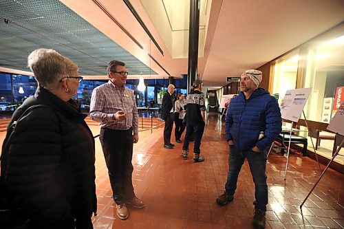 The City of Brandon's director of engineering services, Mark Allard (left), talks to Tristan Lepischak (right) at n open house for the southwest lift station project on Tuesday. (Colin Slark/The Brandon Sun)