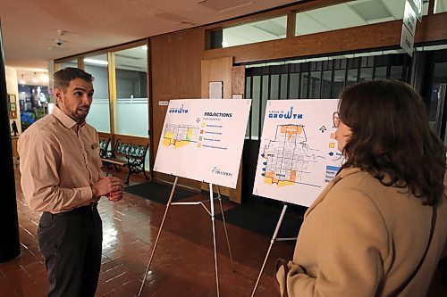 Brandon's director of planning and buildings, Ryan Nickel, talks to a member of the public during the open house for the southwest lift station project on Tuesday evening. (Colin Slark/The Brandon Sun)