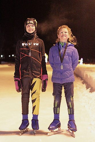 Zoe, left, and Sophia Forbes of Brandon captured silver and gold medals, respectively, at speedskating provincials in Winnipeg on Saturday. (Thomas Friesen/The Brandon Sun)