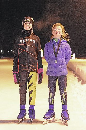 Zoe, left, and Sophia Forbes of Brandon captured silver and gold medals, respectively, at speedskating provincials in Winnipeg on Saturday. (Thomas Friesen/The Brandon Sun)