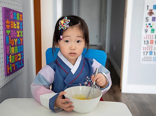 JESSICA LEE / WINNIPEG FREE PRESS

Yena, 3, beats eggs, helping her mom Minhee Kim prepare rice cake soup or Tteokguk in their home on January 16, 2023.

Reporter: Eva Wasney