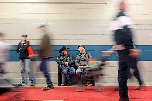17012023
Ron Kristjansson of Justice and Phil Harder of Moore Park visit as visitors to Manitoba Ag Days 2023 pass by at The Keystone Centre on Tuesday.  (Tim Smith/The Brandon Sun)