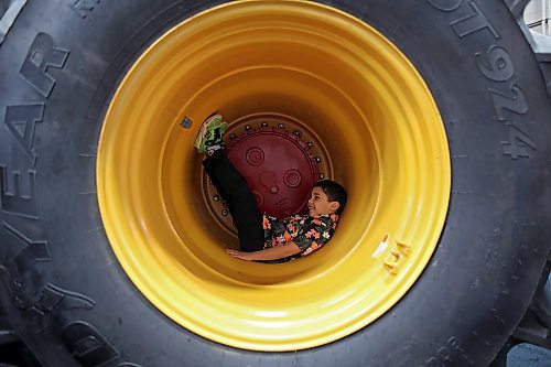 17012023
Five-year-old Isaac Jayaranjan sits in the tire well of a Versatile tractor during Manitoba Ag Days 2023 at The Keystone Centre on Tuesday.  (Tim Smith/The Brandon Sun)