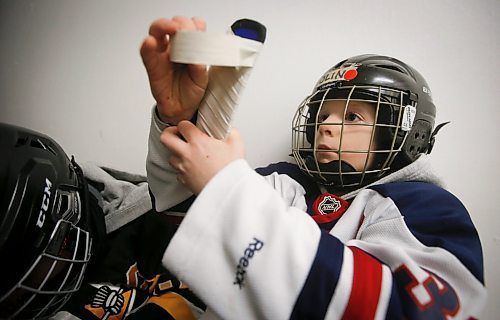 JOHN WOODS / WINNIPEG FREE PRESS
Olin Andrew, 7, tapes his stick before he hits the ice for hockey practice at Deer Lodge Community Centre Tuesday, January 17, 2023. 

Re: sanderson
