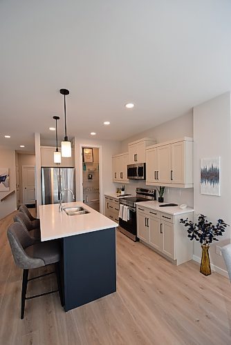 Todd Lewys / Winnipeg Free Press

Anchored by a mid-sized island, the kitchen offers plenty of room to create in this spacious townhome condo.