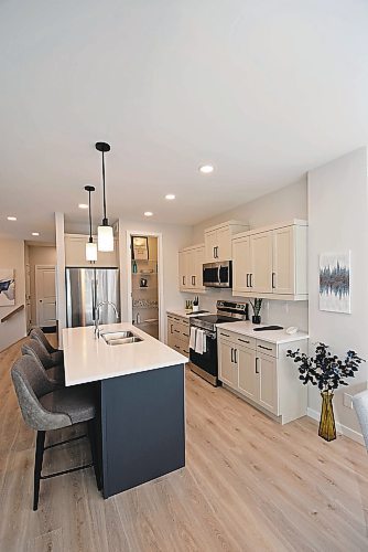 Todd Lewys / Winnipeg Free Press

Anchored by a mid-sized island, the kitchen offers plenty of room to create in this spacious townhome condo.