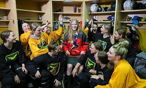 RUTH BONNEVILLE / WINNIPEG FREE PRESS 

SPORTS - Pickering

Photo of Balmoral Hall defenceman Avery Pickering being celebrated by her teammates in the dressing room after practice at Hockey for all Centre (Iceplex), Wednesday. Pickering wears her medal after returning from the world U18 championship recenlty.



Staffing: Sawatzky

Jan 18th,  2023