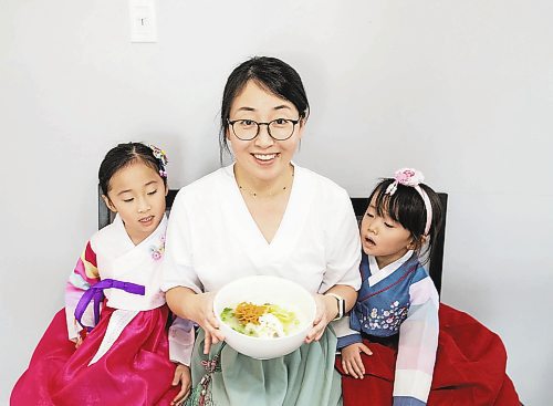 JESSICA LEE / WINNIPEG FREE PRESS

Minhee Kim and her children Dana, 5, and Yena, 3, are photographed with rice cake soup or Tteokguk in their home on January 16, 2023.

Reporter: Eva Wasney