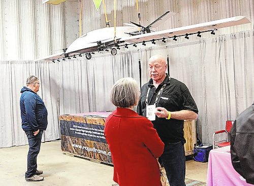 ROGA Drone CEO and founder Don Campbell speaks with Lois Gray during the Innovation Showcase at Manitoba Ag Days earlier this month. Thirty-two products and services competed in seven categories. (Ian Hitchen/The Brandon Sun)