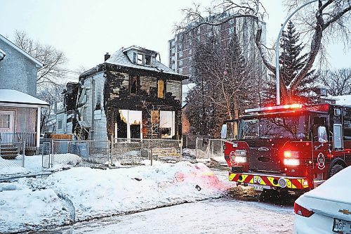 MIKE DEAL / WINNIPEG FREE PRESS
Winnipeg Police Service hold the scene of a fire that was called in around 11 p.m. Wednesday evening in a vacant, two-storey house at 446 Pritchard Avenue. The building is reportedly unstable and will be torn down. 
20230119 - Thursday, January 19, 2023