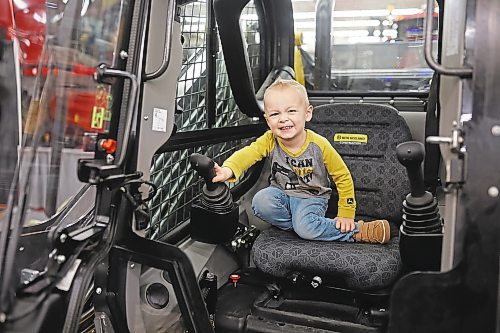 19012023
Two-year-old Liam Klassen explores the cab of a front-end-loader while exploring Manitoba Ag Days 2023 with his parents Bobby and Vanessa on Thursday.
(Tim Smith/The Brandon Sun)