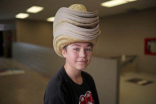 19012023
Brock (no last name given) wears 14 cowboy hats he collected while exploring Manitoba Ag Days 2023 on Thursday.
(Tim Smith/The Brandon Sun)
