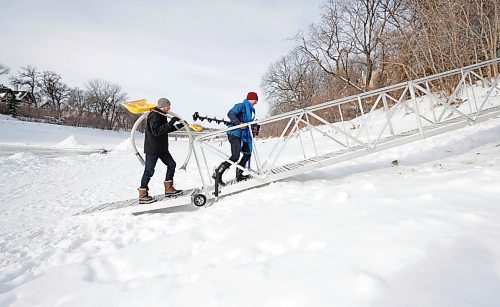 RUTH BONNEVILLE / WINNIPEG FREE PRESS
LOCAL - river rules
Ross Brownlee, a member of the Winter Wonderland group, and Jarrett Rempel a physical education teacher at Westgate Mennonite Collegiate, flood a skating area on the river to prepare a skating trail Thursday.
Also, photo of the steel ramp access to the river level behind Westgate Mennonite Collegiate. The city paid for this and it would be beneficial to have a photo for my story.
For story on more residents using the river for activities and who is responsible for rules of use.
Tyler Searle
Multi-media producer, Winnipeg Free Press
Jan 19th, 2023