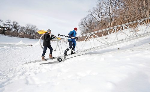 RUTH BONNEVILLE / WINNIPEG FREE PRESS 

LOCAL - river rules

Ross Brownlee, a member of the Winter Wonderland group, and Jarrett Rempel a physical education teacher at Westgate Mennonite Collegiate, flood a skating area on the river to prepare a skating trail Thursday. 

Also, photo of the steel ramp  access to the river level behind Westgate Mennonite Collegiate. The city paid for this and it would be beneficial to have a photo for my story.

For story on more residents using the river for activities and who is responsible for rules of use.

Tyler Searle
Multi-media producer, Winnipeg Free Press

Jan 19th,  2023