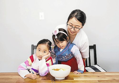 JESSICA LEE / WINNIPEG FREE PRESS

Minhee Kim and her children Dana, 5, and Yena, 3, are photographed with rice cake soup or Tteokguk in their home on January 16, 2023.

Reporter: Eva Wasney