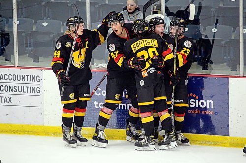 The Waywayseecappo Wolverines, pictured here celebrating a win against the Dauphin Kings in 2021, will be holding an Expanding Community Cancer Care Committee (ECCCC) benefit game on Feb. 4. The ECCCC is currently fundraising for the new Community Cancer Care Centre in Russell, Man. (Lucas Punkari/The Brandon Sun)