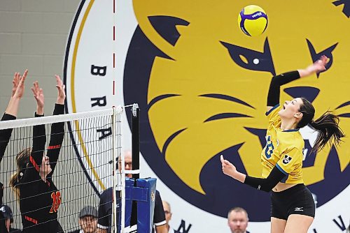 20012023
Keely Anderson #10 of the Brandon University Bobcats hammers the ball over the net during university volleyball action against the University of Calgary Dinos at the BU Healthy Living Centre on Friday evening. The Bobcats lost to the Dinos in five sets.
(Tim Smith/The Brandon Sun)