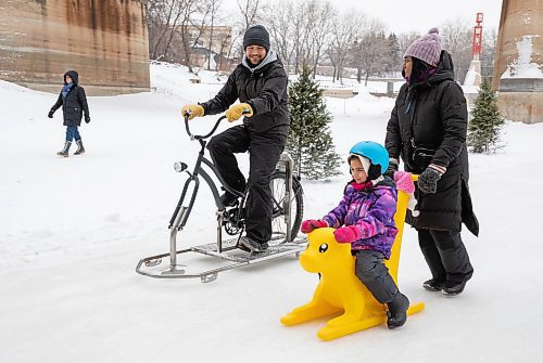 JESSICA LEE / WINNIPEG FREE PRESS

Chris Kitching tries an ice-bike at The Forks on January 20, 2023, while AV Kitching pushes their daughter Faith.

Reporter: AV Kitching