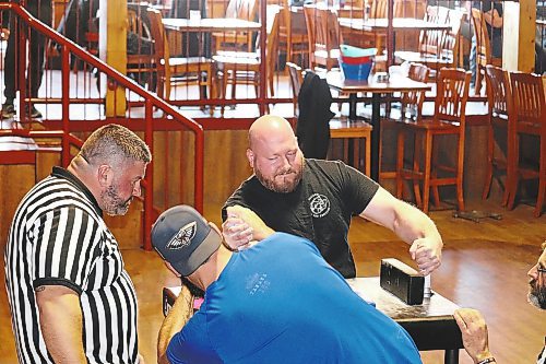 Matt Sedor (rear) tries to best fellow Winnipeg resident Kyle Backlund during a Saturday afternoon arm wrestling tournament in Brandon. This event was hosted by the Manitoba Arm Wrestling Association at Houstons Country Roadhouse. (Kyle Darbyson/The Brandon Sun)