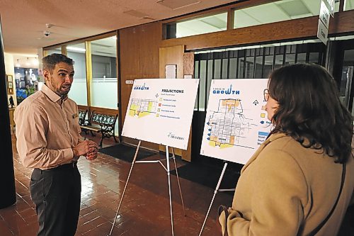 Brandon's director of planning and buildings, Ryan Nickel, talks to a member of the public during the open house for the southwest lift station project on Tuesday evening. (Colin Slark/The Brandon Sun)