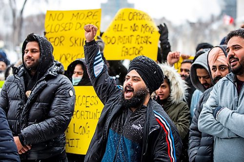 MIKAELA MACKENZIE / WINNIPEG FREE PRESS

Harpreet Singh, whose work visa is running out in six months, protests against Manitoba Provincial Nominee Program policies at a rally at the Manitoba Legislative Building in Winnipeg on Monday, Jan. 23, 2023. For Carol story.
Winnipeg Free Press 2023.