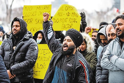 MIKAELA MACKENZIE / WINNIPEG FREE PRESS

Harpreet Singh, whose work visa is running out in six months, protests against Manitoba Provincial Nominee Program policies at a rally at the Manitoba Legislative Building in Winnipeg on Monday, Jan. 23, 2023. For Carol story.
Winnipeg Free Press 2023.