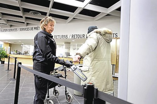 RUTH BONNEVILLE / WINNIPEG FREE PRESS
Local - Library opens
Security personal check for dangerous metal objects on being carried by library users on the first day of the Millennium Library opening Monday. Lineups formed during the first 45 mins due to the security checks.
See story.
Jan 23rd, 2023