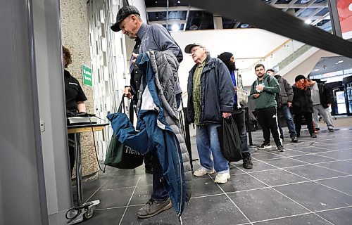 RUTH BONNEVILLE / WINNIPEG FREE PRESS
Local - Library opens
Security personal check for dangerous metal objects on being carried by library users on the first day of the Millennium Library opening Monday. Lineups formed during the first 45 mins due to the security checks.
See story.
Jan 23rd, 2023