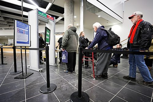 RUTH BONNEVILLE / WINNIPEG FREE PRESS
Local - Library opens
Security personal check for dangerous metal objects on being carried by library users on the first day of the Millennium Library opening Monday. Lineups formed during the first 45 mins due to the security checks.
See story.
Jan 23rd, 2023