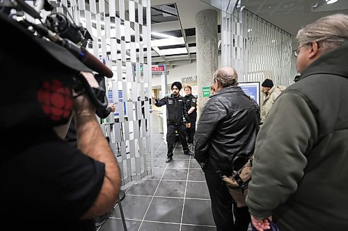 RUTH BONNEVILLE / WINNIPEG FREE PRESS
Local - Library opens
Security personal check for dangerous metal objects on being carried by library users on the first day of the Millennium Library opening Monday. Lineups formed during the first 45 mins due to the security checks.
See story.
Jan 23rd, 2023