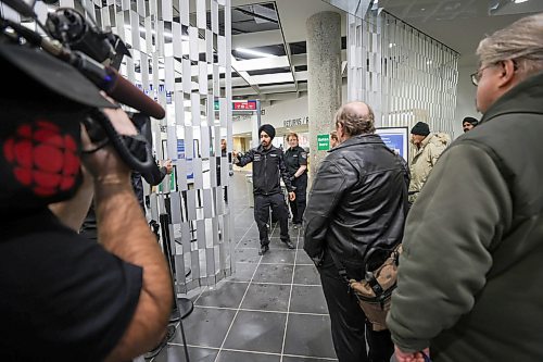 RUTH BONNEVILLE / WINNIPEG FREE PRESS
Local - Library opens
Security personal check for dangerous metal objects on being carried by library users on the first day of the Millennium Library opening Monday. Lineups formed during the first 45 mins due to the security checks.
See story.
Jan 23rd, 2023