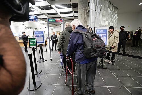 RUTH BONNEVILLE / WINNIPEG FREE PRESS
Local - Library opens
Security personal check for dangerous metal objects on being carried by library users on the first day of the Millennium Library opening Monday. Lineups formed during the first 45 mins due to the security checks.
Bob Bibwell (83yrs), waits in line to go through the security checks Monday.
See story.
Jan 23rd, 2023