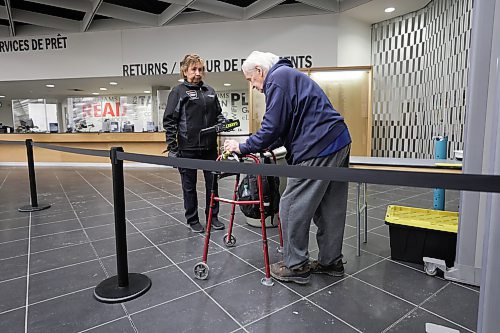 RUTH BONNEVILLE / WINNIPEG FREE PRESS 

Local - Library opens

Security personal check for dangerous metal objects on being carried by library users on the first day of the Millennium Library opening Monday.  Lineups formed during the first 45 mins due to the security checks.

Bob Bibwell (83yrs), goes through the security checks Monday. 


See story.
Jan 23rd,  2023