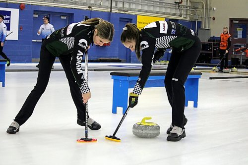 Second Mikaylah Lyburn, left, and lead Makenna Hadway of Katy Lukowich's rink from the Fort Garry Curling Club in Winnipeg sweep a rock during the women's event final of the Sun Life Financial Junior Challenge at the Brandon Curling Club in November. The rink is competing in this week's Manitoba Scotties Tournament of Hearts in East St. Paul. (Lucas Punkari/The Brandon Sun)